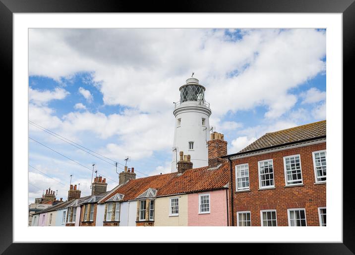 Southwold Lighthouse behind colourful houses Framed Mounted Print by Jason Wells