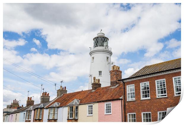 Southwold Lighthouse behind colourful houses Print by Jason Wells