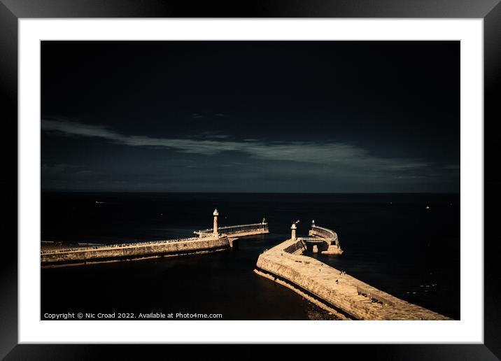 The piers of Whitby Framed Mounted Print by Nic Croad