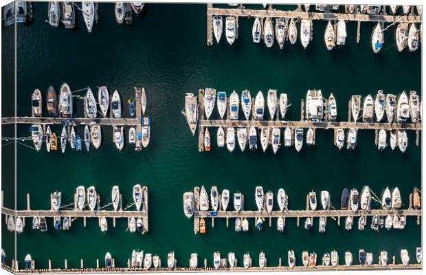 Aerial top down view of many luxurious yachts moored in marina Canvas Print by Alexandre Rotenberg
