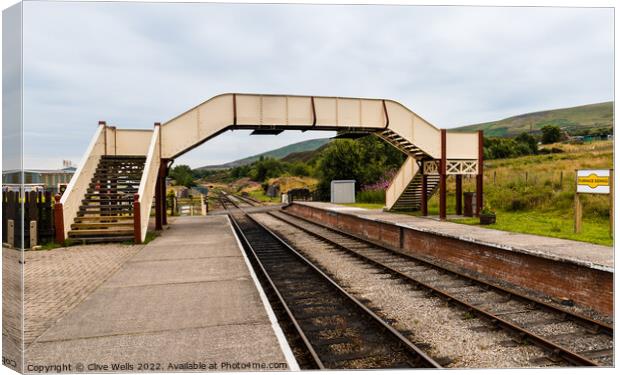 Footbridge over the tracks Canvas Print by Clive Wells