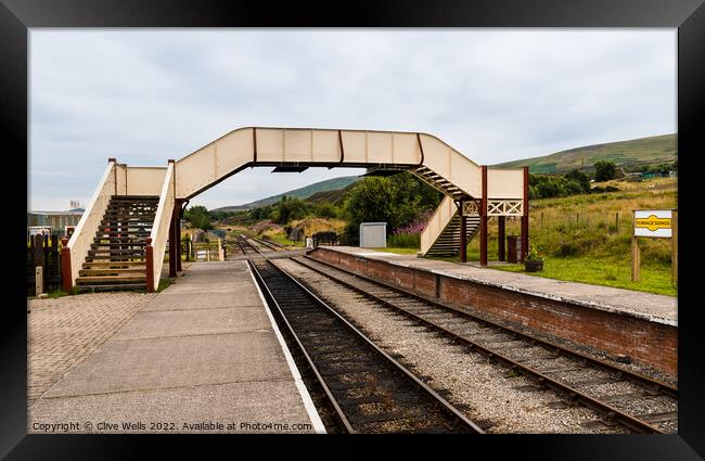 Footbridge over the tracks Framed Print by Clive Wells