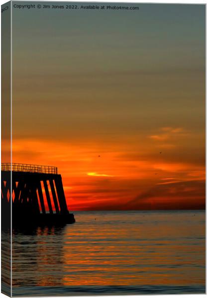 Sunrise, seagulls and silhouettes Canvas Print by Jim Jones