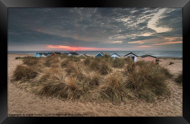 Beach Hut Sunrise on Southwold Beach Framed Print by David Powley