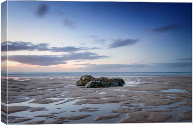 Porthmeor beach rocks at sunset Canvas Print by Jonathan Thirkell