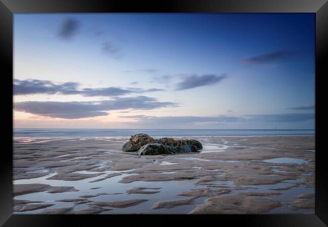 Porthmeor beach rocks at sunset Framed Print by Jonathan Thirkell