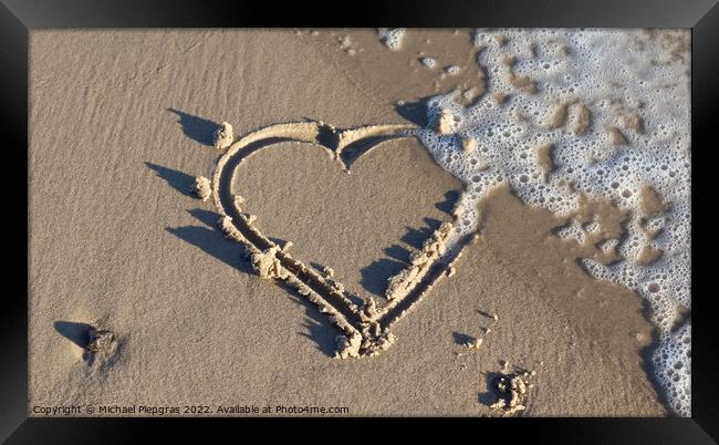 A beautiful heart shape painted into the sand of a baltic sea be Framed Print by Michael Piepgras