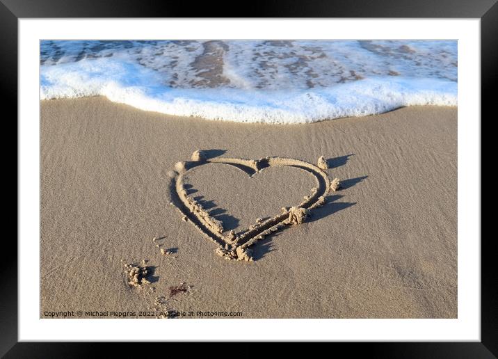 A beautiful heart shape painted into the sand of a baltic sea be Framed Mounted Print by Michael Piepgras