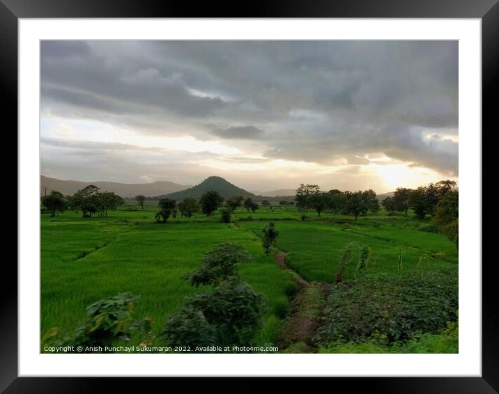 beautiful river near mountain under cloudy sky and a rice field Framed Mounted Print by Anish Punchayil Sukumaran