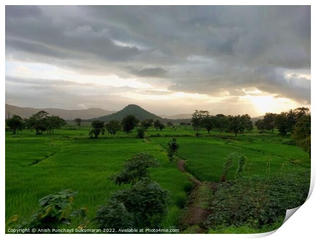 beautiful river near mountain under cloudy sky and a rice field Print by Anish Punchayil Sukumaran