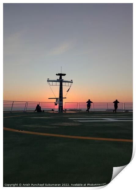 people enjoying sunset on the a helipad of a cruise ship Print by Anish Punchayil Sukumaran