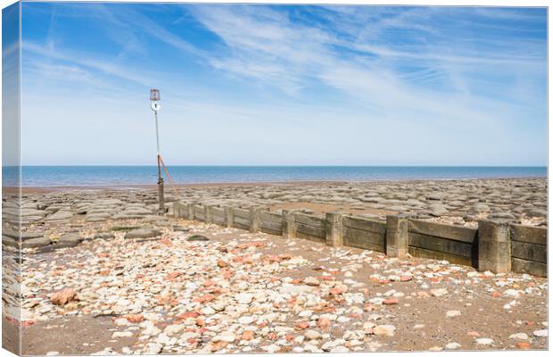 Red and white rocks on Hunstanton beach Canvas Print by Jason Wells