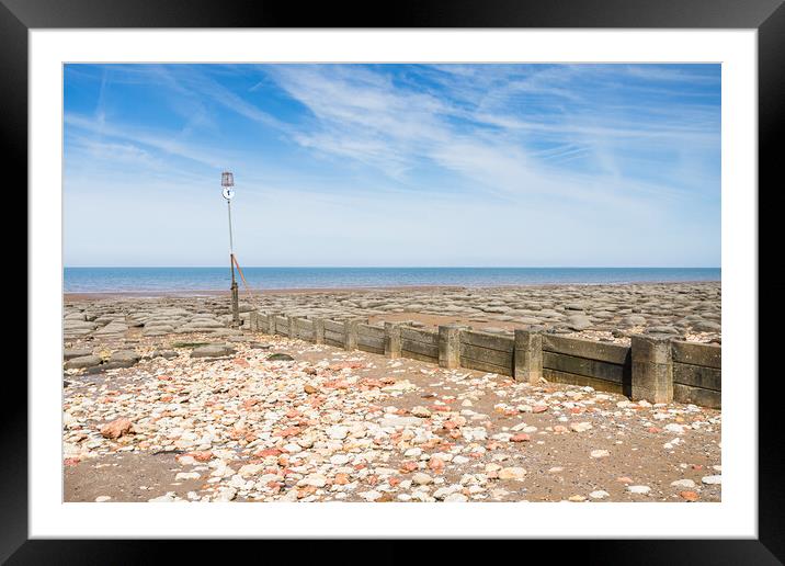 Red and white rocks on Hunstanton beach Framed Mounted Print by Jason Wells
