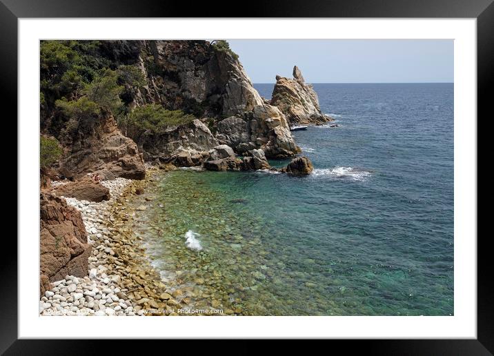 Pebble beach along the the Costa Brava coastline in Spain Framed Mounted Print by Lensw0rld 
