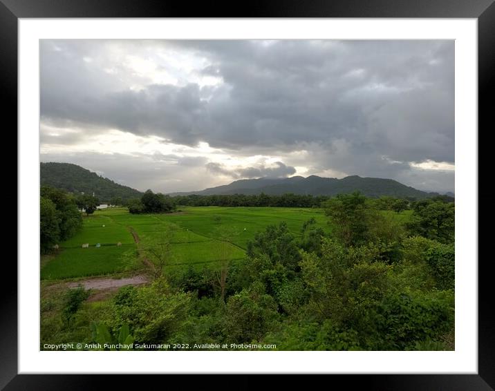 beautiful river near mountain under cloudy sky and a rice field Framed Mounted Print by Anish Punchayil Sukumaran