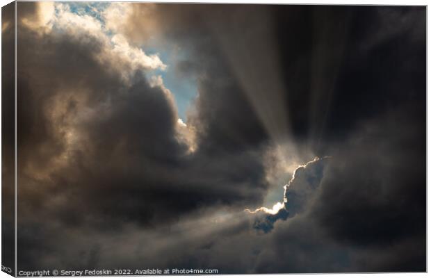 Dramatic storm clouds with sun rays. Canvas Print by Sergey Fedoskin