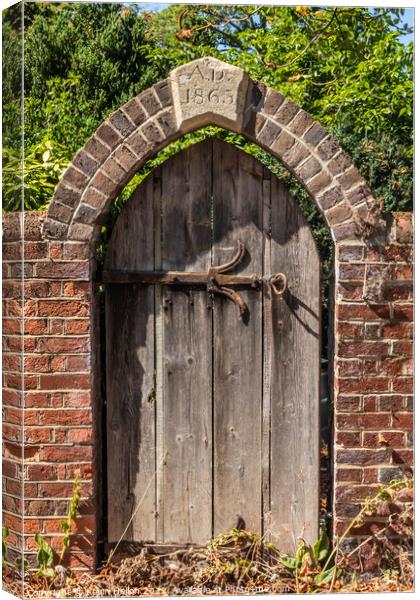 Old wooden gate with wrought iron fittings  Canvas Print by Kevin Hellon