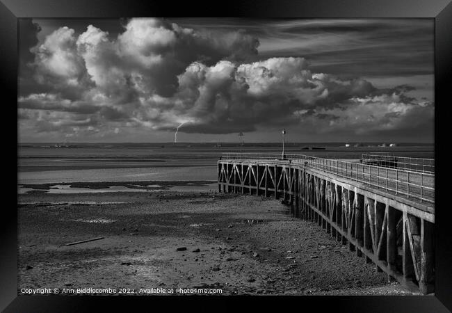 Abandoned pier awaiting the storm Framed Print by Ann Biddlecombe