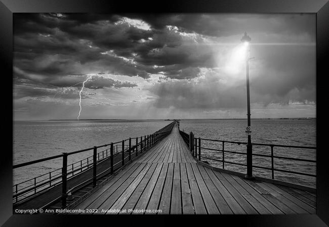 Southend on Sea pier as the storm comes in in black and white Framed Print by Ann Biddlecombe