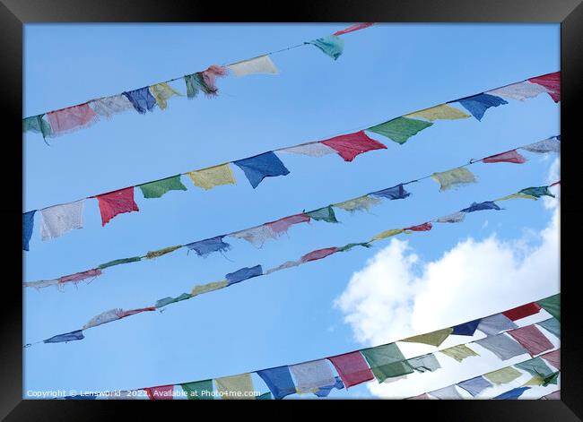 Tibetan prayer flags against the blue sky Framed Print by Lensw0rld 