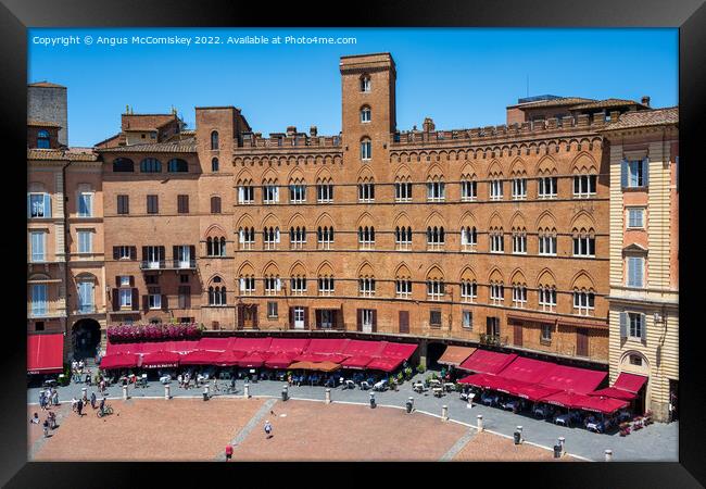Medieval buildings in Piazza del Campo in Siena Framed Print by Angus McComiskey