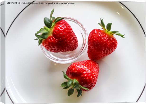 Strawberries with leaves on a plate in a glas bowl. Isolated on  Canvas Print by Michael Piepgras