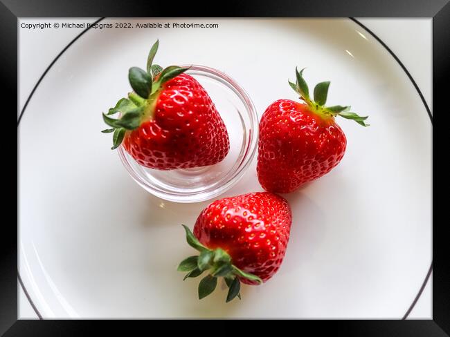 Strawberries with leaves on a plate in a glas bowl. Isolated on  Framed Print by Michael Piepgras