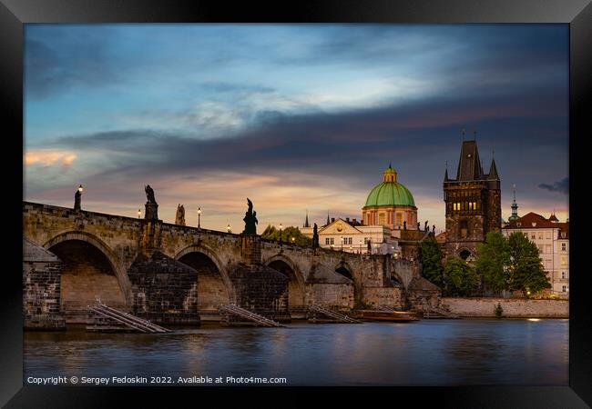 Colorful sunset view on old town, Charles bridge (Karluv Most - in czech) and Vltava river, Prague, Czech Republic. Framed Print by Sergey Fedoskin