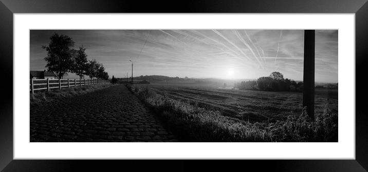paving sett roadin autumnal sunlight in black and white Framed Mounted Print by youri Mahieu
