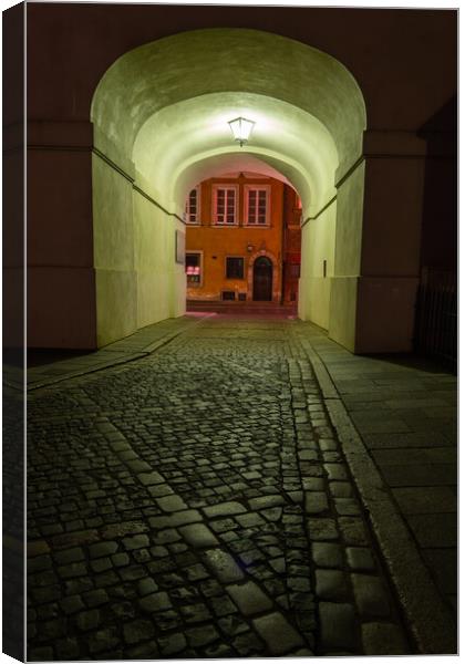 Empty Cobbled Street In City By Night Canvas Print by Artur Bogacki