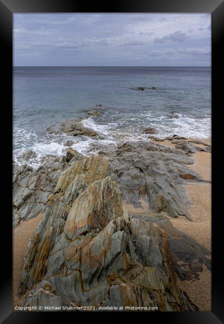 Rock formations on the beach at Porthleven in Corn Framed Print by Michael Shannon