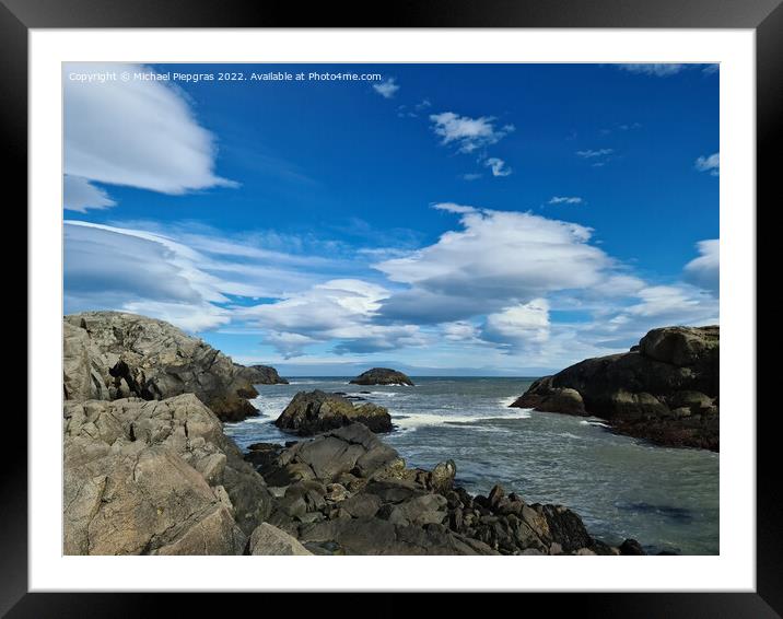 A surf on a rocky beach with black sand in Iceland. Framed Mounted Print by Michael Piepgras