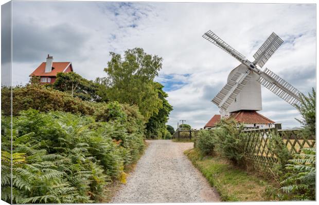 Thorpeness windmill next to the House in the Clouds Canvas Print by Jason Wells