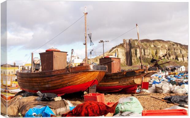Clinker built fishing boats on Hastings Beach Canvas Print by Sally Wallis