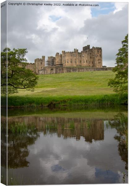 Reflections of Alnwick Castle Canvas Print by Christopher Keeley