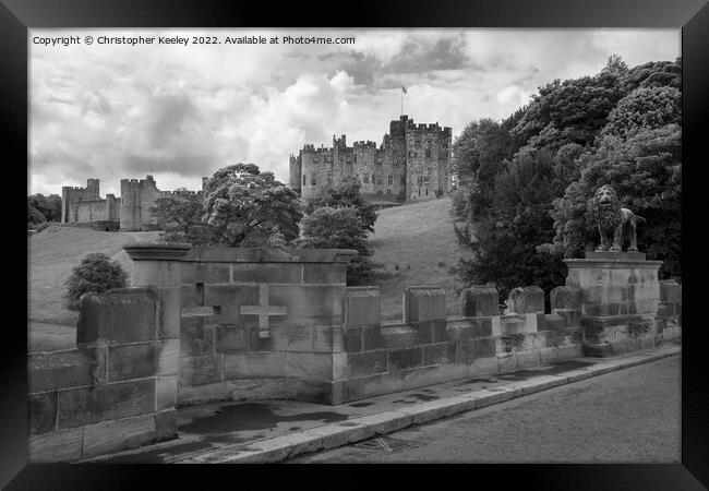 Alnwick Castle in black and white Framed Print by Christopher Keeley