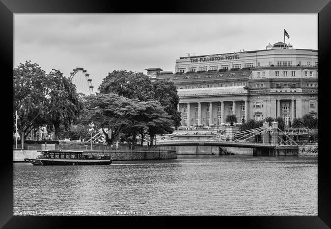 The Fullerton Hotel and bum boat, Singapore Framed Print by Kevin Hellon