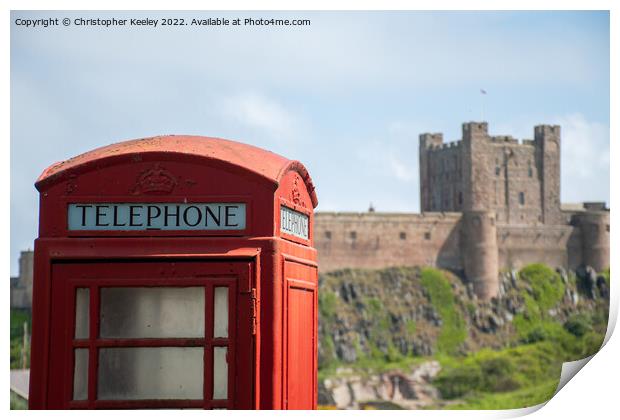 Bamburgh Castle red telephone box Print by Christopher Keeley