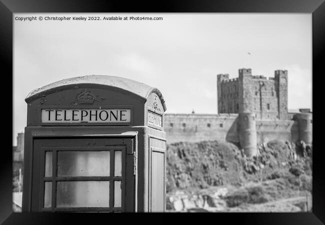 Black and white Bamburgh Castle telephone box Framed Print by Christopher Keeley
