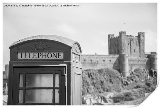 Black and white Bamburgh Castle telephone box Print by Christopher Keeley