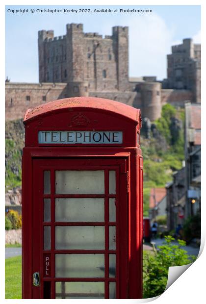 Telephone box at Bamburgh Castle Print by Christopher Keeley