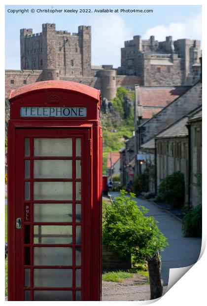 Red telephone box and Bamburgh Castle Print by Christopher Keeley