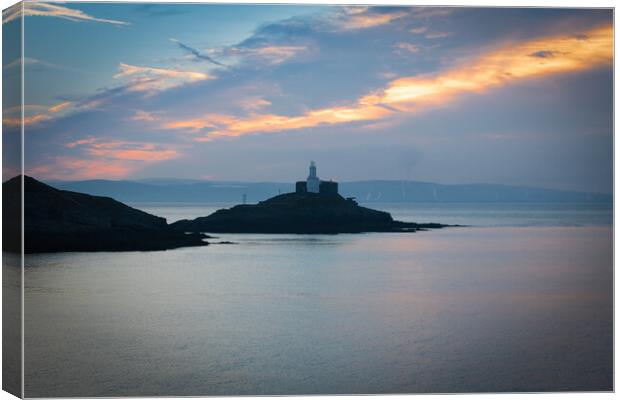 Mumbles lighthouse at sunrise Canvas Print by Bryn Morgan