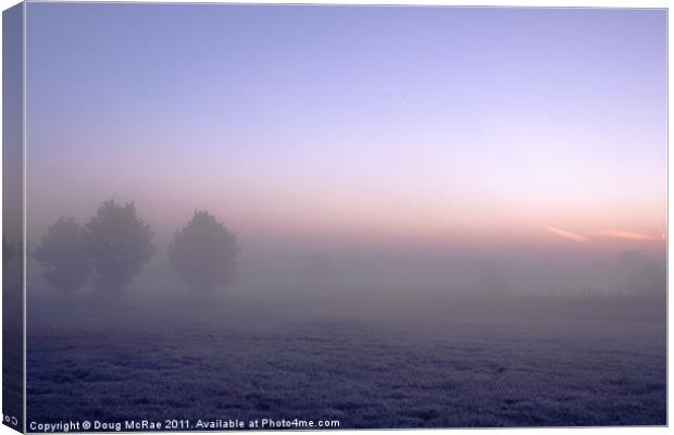 Sunrise through the mist Canvas Print by Doug McRae