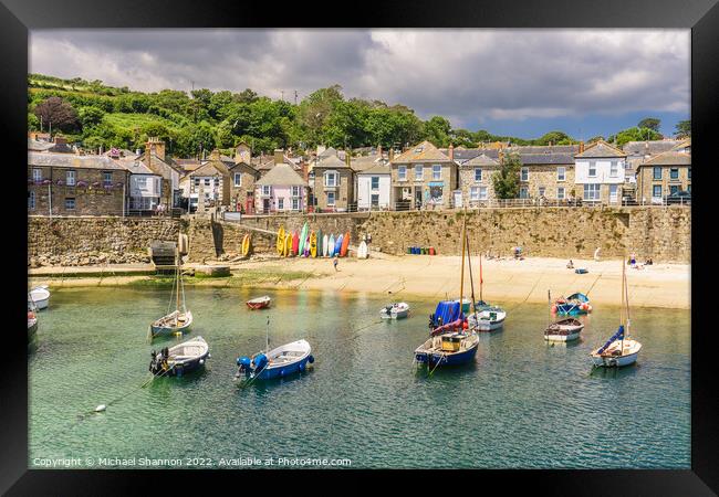 The harbour and beach in Mousehole, Cornwall Framed Print by Michael Shannon