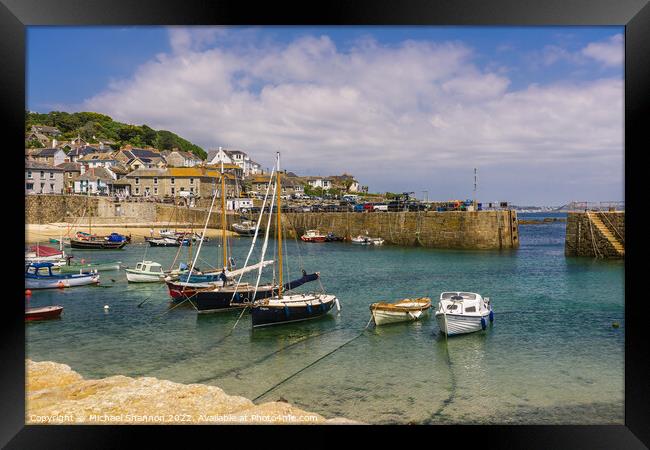 Yachts and small boats moored in Mousehole, Cornwa Framed Print by Michael Shannon