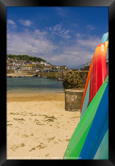 Surfboards stacked in Mousehole harbour, Cornwall Framed Print by Michael Shannon