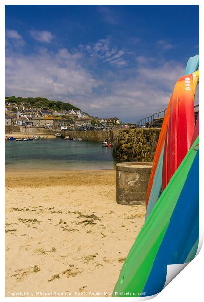 Surfboards stacked in Mousehole harbour, Cornwall Print by Michael Shannon