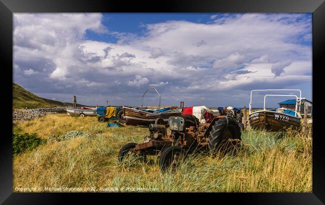 Old tractors and boats near the beach at Skinningr Framed Print by Michael Shannon