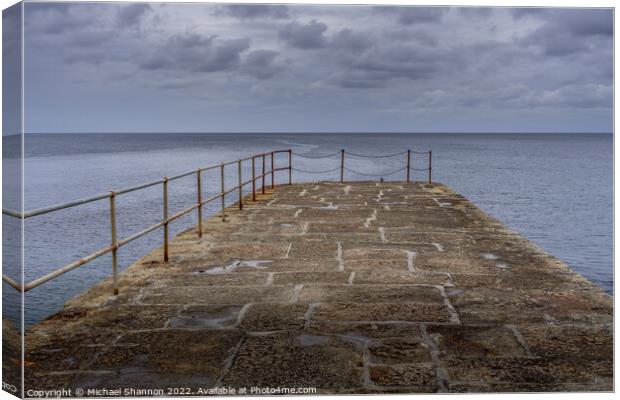 Looking out to sea from the stone pier at Porthlev Canvas Print by Michael Shannon